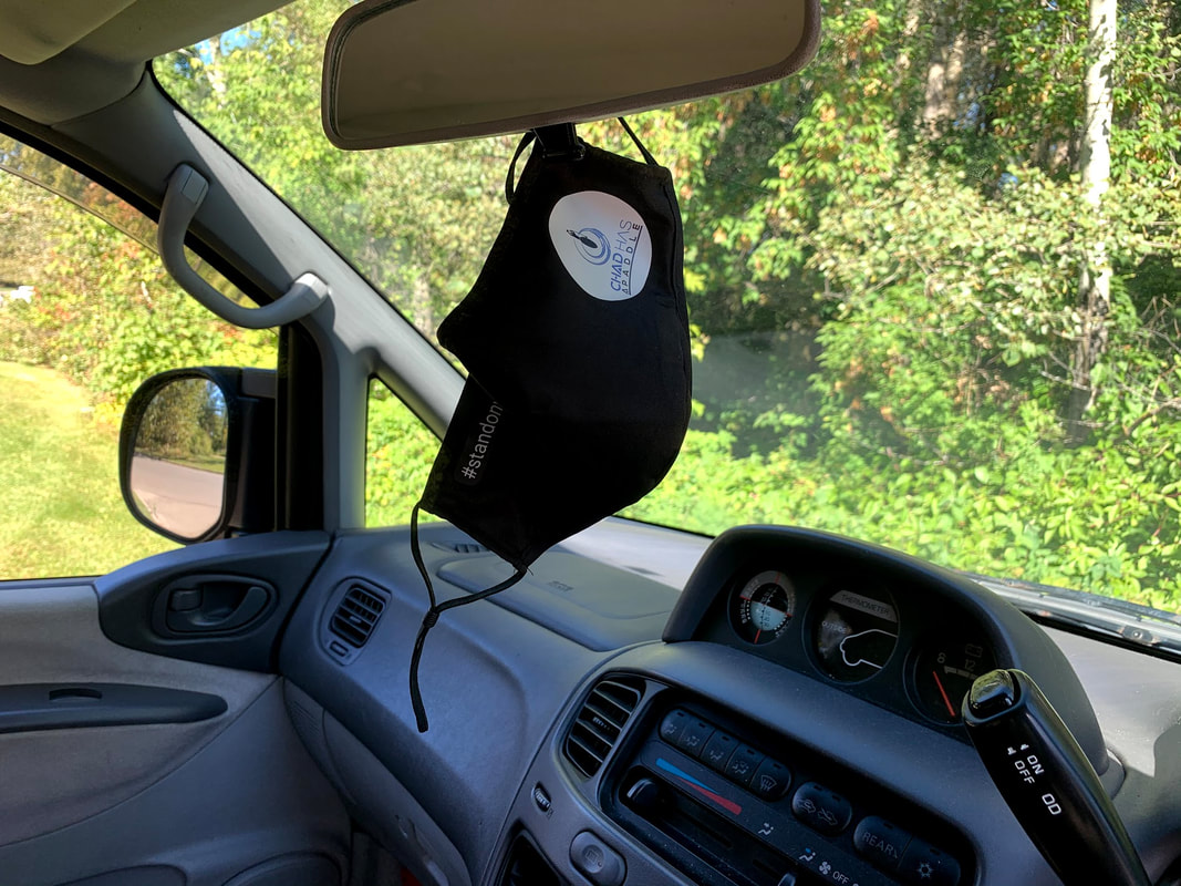 Chad Has A Paddle face mask hanging from rear view mirror